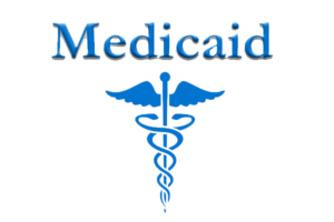 Blue text "Medicaid" with a blue Caduceus symbol below it.